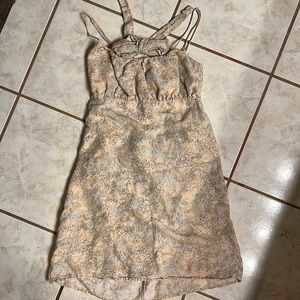 H&M medium dress. Ties a bow in back.